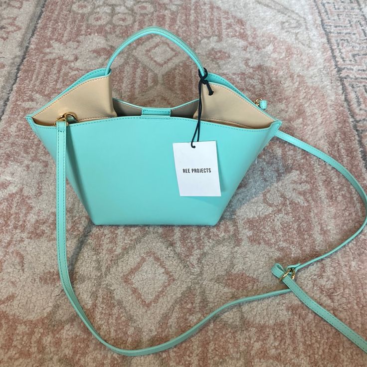 Nwt, No Flaws. Gorgeous Mint/ Tiffany Blue And Nude Contrast. No Dust Bag But Have Authenticity Card. 7”W X 6 1/2”H X 4 1/2”D. (Interior Capacity: Small.) 3 1/2 Handle; 11" - 25" Crossbody Strap Drop .7 Lbs Luxury Blue Box Bag For Errands, Designer Blue Rectangular Bucket Bag, Modern Blue Box Bag With Dust Bag, Designer Blue Box Bag With Detachable Handle, Designer Blue Box Bag For Shopping, Designer Blue Box Bag For Everyday Use, Designer Blue Tote Box Bag, Blue Box Bag With Removable Pouch For Errands, Blue Leather Box Bag For Errands