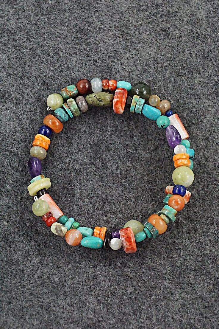 This beaded turquoise, coral, lapis, amber, spiny oyster, mother of pearl, abalone, jasper, onyx and amethyst stretchy wrap bracelet was expertly crafted by Navajo artisan Helen Tsosie.Circumference: 5 1/2" (adjustable)Width: 1/2"Free shipping on all orders! We ship with USPS and always include tracking. All orders ship within a day of payment.Returns are accepted up to 30 days after you receive your order. Just send us a message. Our shop offers cash back or store credit. The item must be returned in new condition. Instagram Jewelry, Bear Carving, Spiny Oyster, Pearl Chain, Multi Stone, Native American Jewelry, Free Jewelry, Stone Beads, Beaded Bracelet