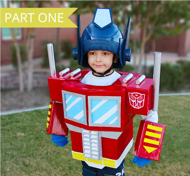 a young boy dressed up as a transformer from the movie's tv series