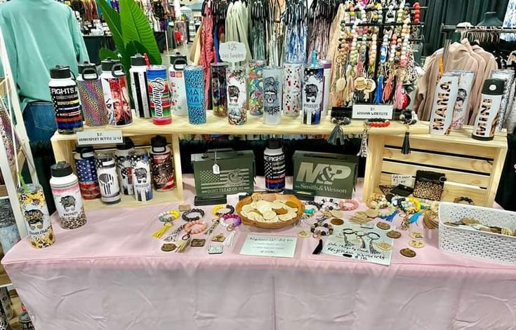 the table is covered with many items for sale