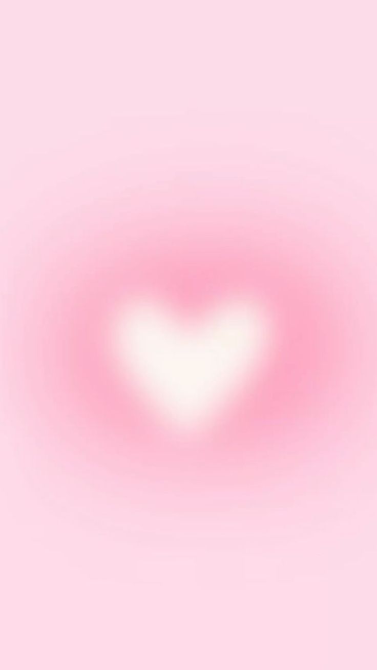 a heart shaped object on a pink background