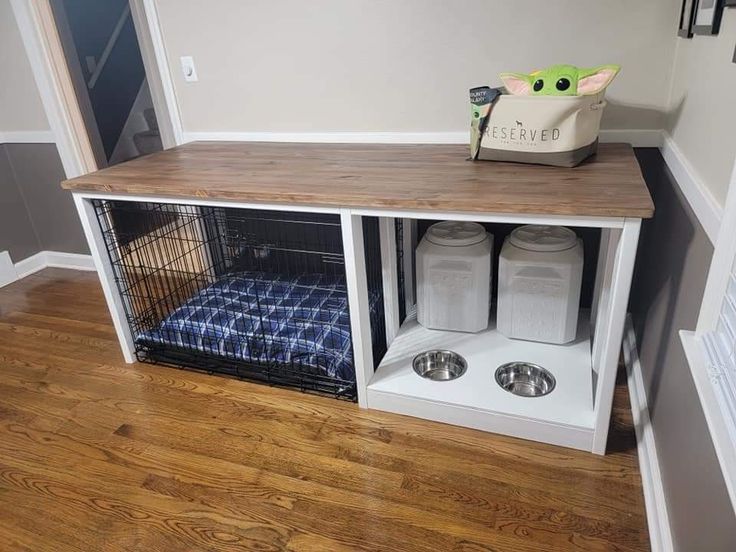 a dog kennel with two dogs in it