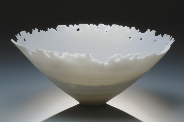 a white bowl sitting on top of a table