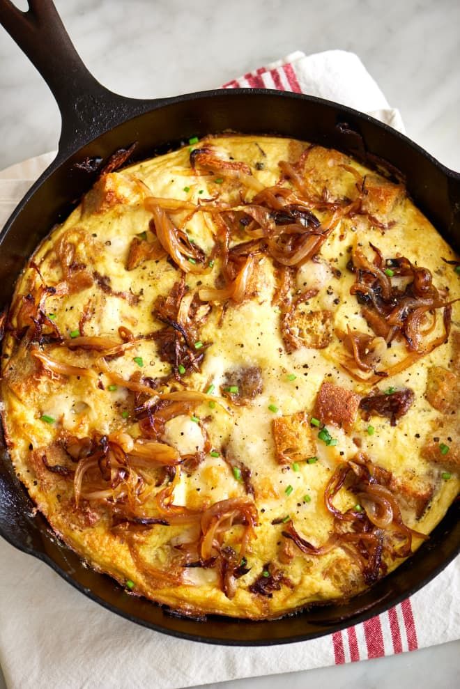 an omelet in a cast iron skillet on a napkin