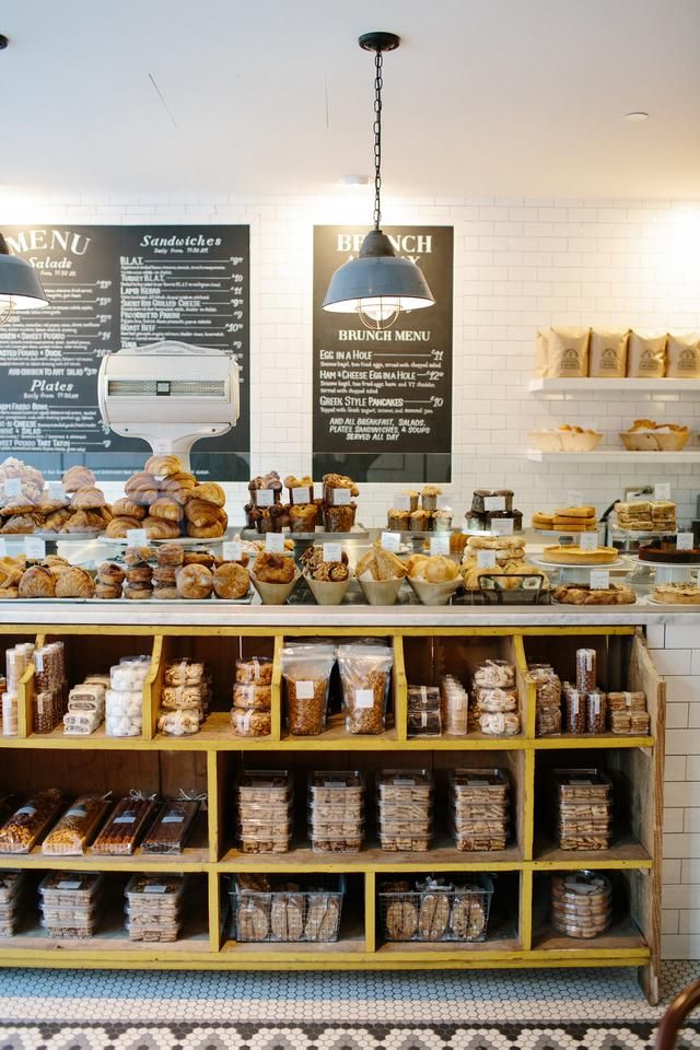 a bakery filled with lots of bread and pastries