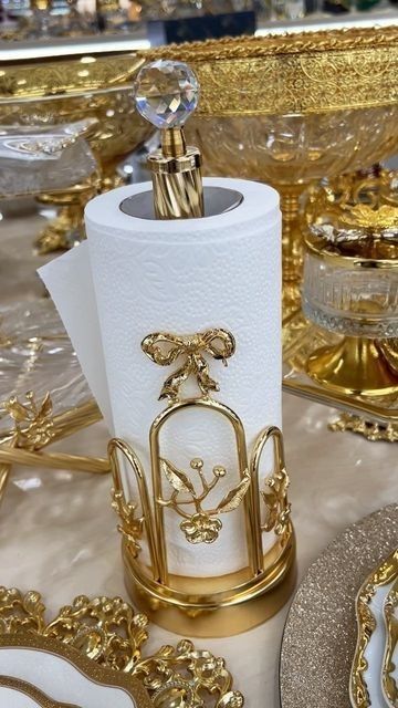 gold and white table setting with fancy napkin holders