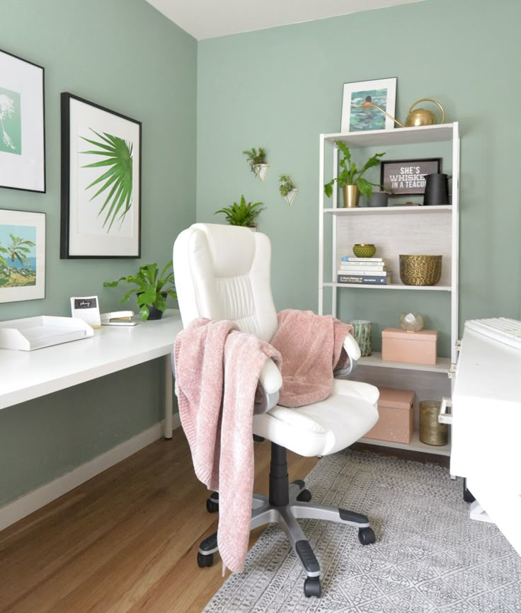 a chair with a blanket on it in front of a desk