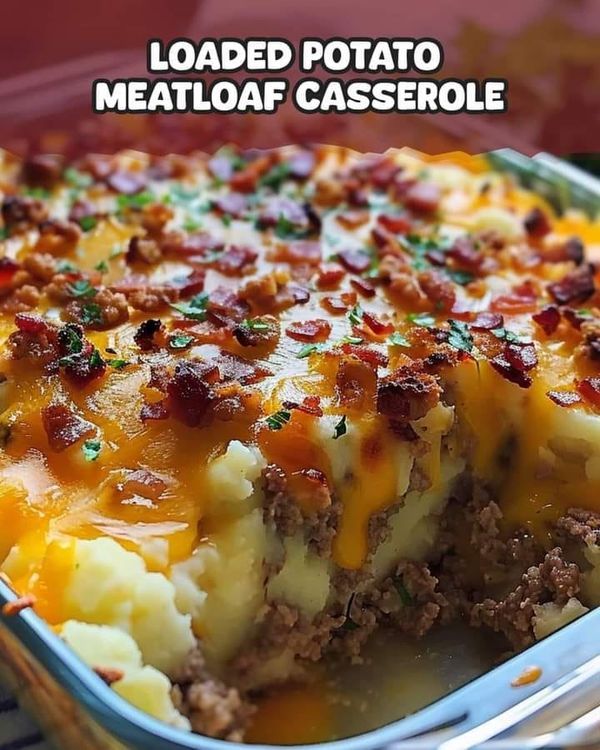 loaded potato meatloaf casserole with cheese and bacon in a metal pan