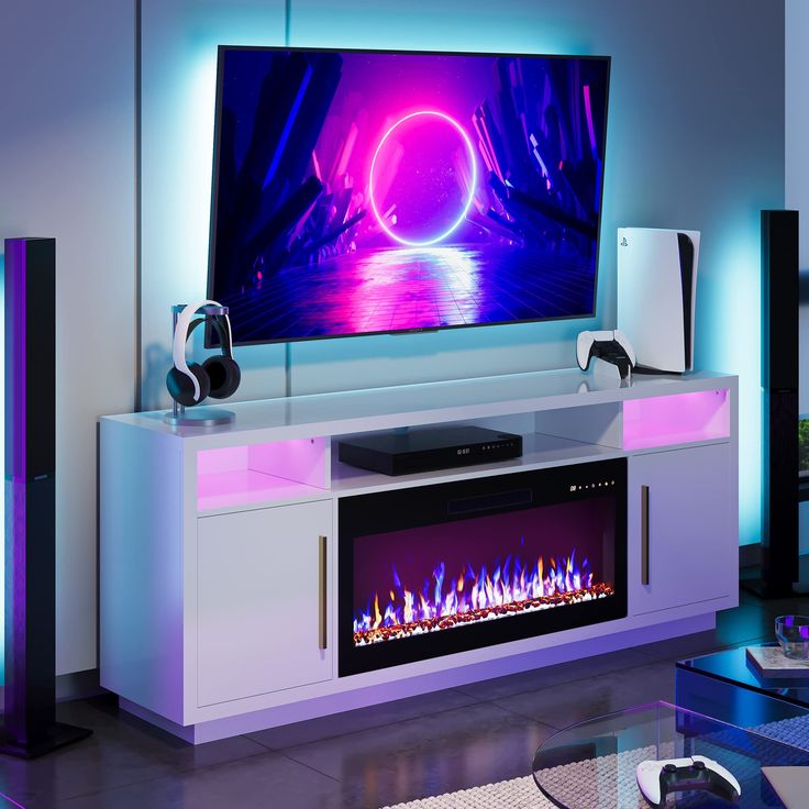 a living room with a large television on the wall and some speakers in front of it