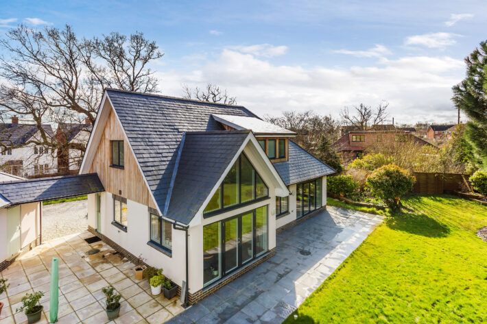 an aerial view of a house with large windows