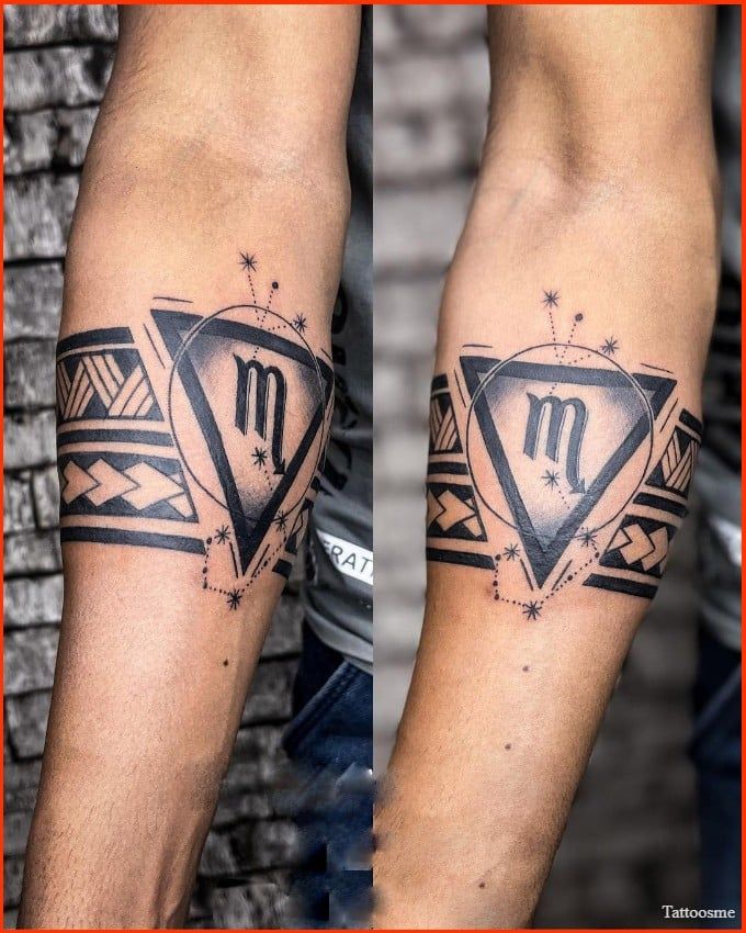 two men's legs with tattoos on them and one has the letter m in it