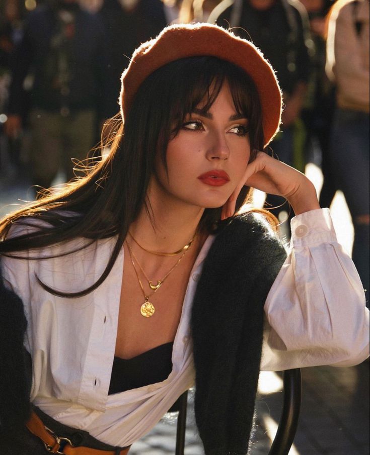 a woman with long hair wearing a hat