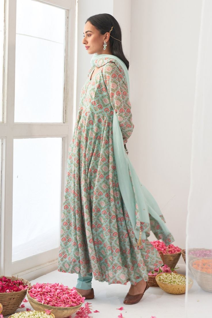 Aqua green floral print anrakali with hand embroidered tassel detail. Paired with solid pant and dupatta with tassels.
Component: 3
Pattern: Hand embroidered, Printed
Type Of Work: Mirror work, Digital print
Neckline: V neck
Sleeve Type: Full sleeves
Fabric: Cotton silk, Organza
Color: Green
Other Details: 
Churidar sleeves
Hand embroidered mirror tassels
Occasion: Mehendi, Reception - Aza Fashions Designer Cotton Silk Anarkali Set With Printed Motifs, Designer Chanderi Anarkali Set With Printed Motifs, Designer Anarkali Set With Printed Motifs And Straight Kurta, Floor-length Chanderi Kurta With Printed Motifs, Green Resham Embroidered Anarkali Set In Mulmul, Anarkali Chanderi Lehenga With Printed Motifs, Chanderi Anarkali Set With Printed Motifs, Chanderi Salwar Kameez With Printed Motifs, Maxi Length, Floor-length Chanderi Salwar Kameez With Printed Motifs