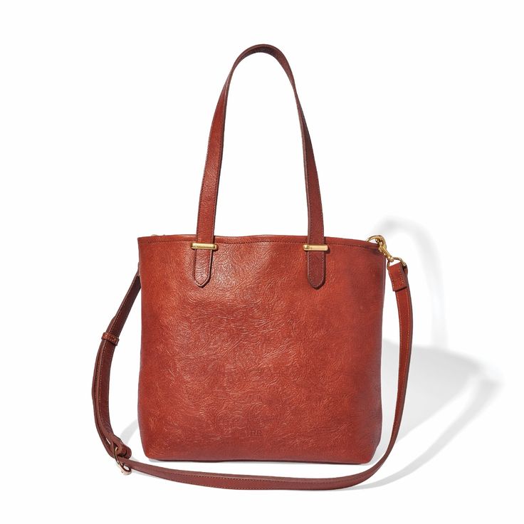 Our classic tote is handcrafted in luxuriously soft, vegetable-tanned American leathers. Spacious, durable, and versatile this tote is ideal for everyday use. For added security, the tote features a large zip-top canvas pouch that snaps in at the sides and can be removed for easy cleaning. A drop-in pocket holds your phone, keys and other small items. Easily convert the tote to a crossbody bag by clipping the optional strap into interior D rings. Crafted by artisans for a lifetime of daily use, Versatile Double Handle Leather Bags, Versatile Leather Bag With Top Carry Handle, Rectangular Textured Leather Bag For On-the-go, Everyday Double Handle Satchel With Leather Handles, Everyday Satchel With Leather Handles And Double Handle, Versatile Textured Leather Top Handle Shoulder Bag, Versatile Textured Leather Bucket Bag For Shopping, Versatile Textured Leather Tote Shoulder Bag, Everyday Top Handle Bag With Leather Handles