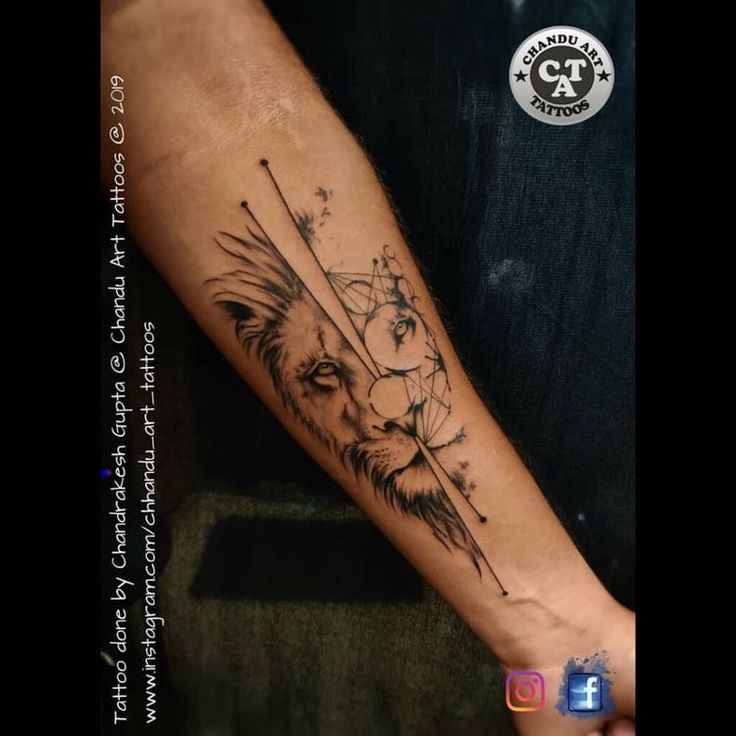 a man's arm with a lion and arrow tattoo on the left inner forearm