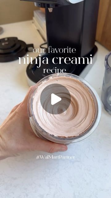 a person holding a bowl of cream in front of a blender with the words our favorite ninja cream recipe