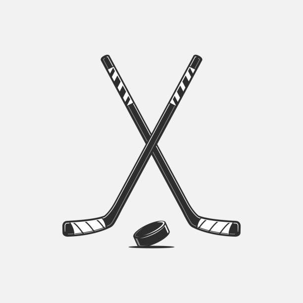 two hockey sticks and puck on a white background