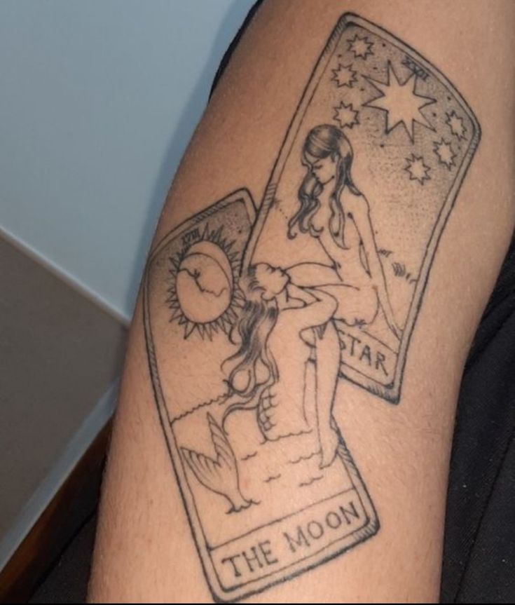 a person with a tattoo on their arm has a tarot card and the moon