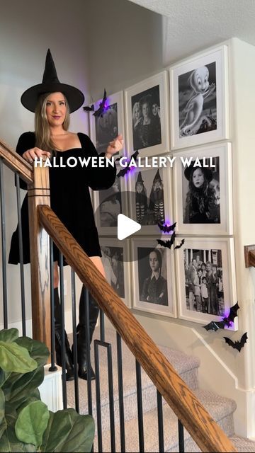 a woman in a witches costume is standing on the stairs with her arms out and pointing