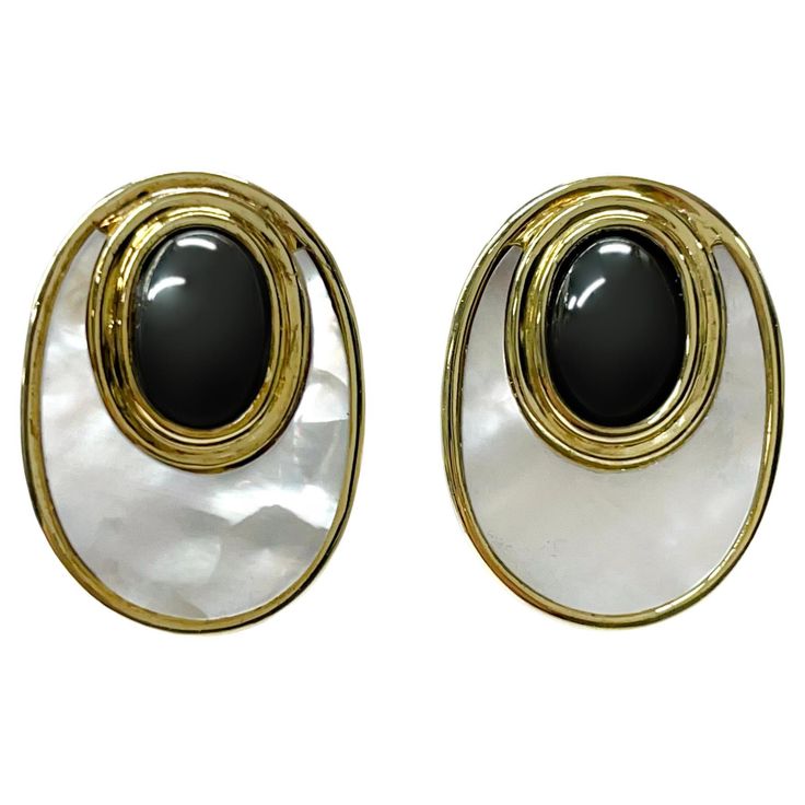 14 Karat Mother of Pearl Hematite Earrings. The earrings feature a double bezel, the larger bezel has flat mother of pearl while the smaller oval bezel has a 9 x 6mm hematite cabochon. The earrings have a post and Omega clip back. Each earring measures 21.9mm tall x 16.4mm wide. Stamped on the bottom of each earring is 14K. The total gold weight of the earrings is 14.1 grams. Hematite Earrings, Hematite Jewelry, Vintage Clip, Mother Pearl, Jewelry Gold, Gold Gold, Gold Yellow, Estate Jewelry, Clip On Earrings