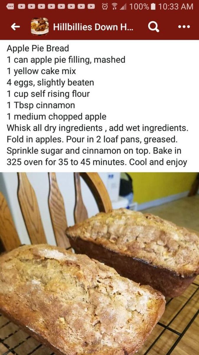 two loaves of bread sitting on top of a cooling rack