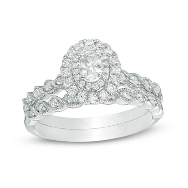 Seal your commitment with this sparkling vintage-inspired diamond bridal set. Crafted in 14K white gold, the engagement ring features a 1/4 ct. oval-cut diamond wrapped in a double frame of diamonds. A milgrain-detailed twist reveals shimmering diamonds along the shank. On your wedding day, the coordinating diamond and milgrain twist shank lends heirloom appeal. Radiant with 3/4 ct. t.w. of diamonds and a brilliant buffed luster, this bridal set is a symbol of your beautiful love story. Zales Engagement Rings, Double Frame, Diamond Frame, Fine Diamond Jewelry, Bridal Fashion Jewelry, Bridesmaid Accessories, Bridesmaid Jewelry Sets, Diamond Bridal Sets, Bridal Bracelet