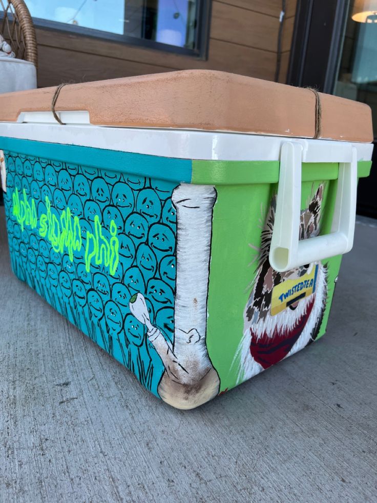 an ice chest sitting on top of a sidewalk