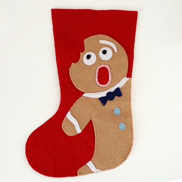 a christmas stocking with an image of a ginger wearing a bow tie and holding a candy cane