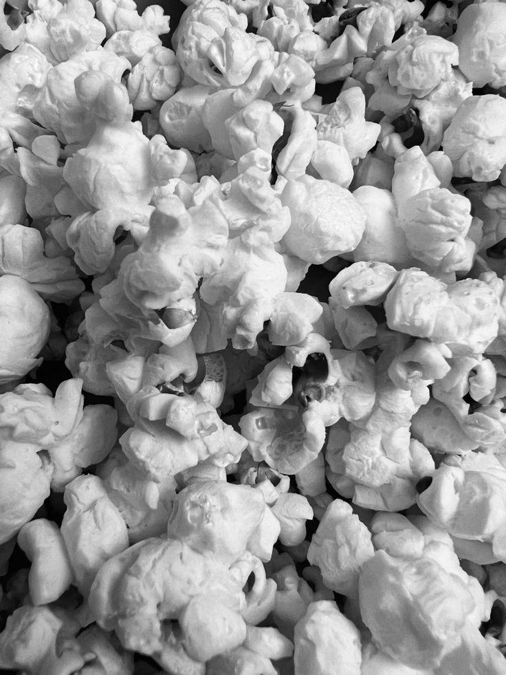 black and white photograph of popcorn kernels piled on top of each other in a pile