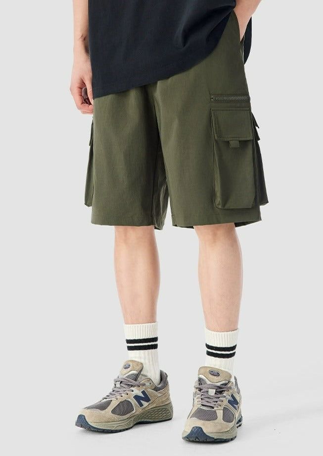 Experience functionality and style with our Cargo Utility Shorts, complete with a zippered pocket for the modern man on the go. Crafted from a breathable blend of 90% nylon and 10% spandex, these shorts feature a low waist, loose straight fit, and ice silk quick-drying properties for ultimate comfort. The edgy design includes a durable dual-duty stitch, ample storage with a large utility pocket, and a classic straight-cut hem for a relaxed silhouette. Versatile and comfortable, these shorts are Utility Bermuda Bottoms With Built-in Shorts, Sporty Cargo Shorts With Built-in Shorts, Utility Bermuda Shorts With Built-in Shorts, Solid Color Cargo Shorts With Pockets For Streetwear, Solid Cargo Shorts With Pockets For Streetwear, Sporty Short Pants With Side Pockets, Khaki Nylon Shorts, Khaki Nylon Cargo Shorts With Pockets, Khaki Nylon Shorts With Pockets