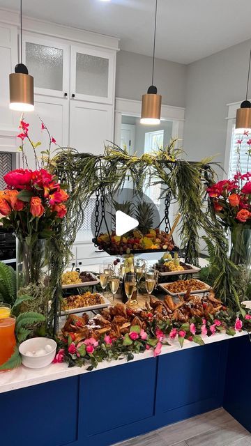 a buffet table filled with food and flowers