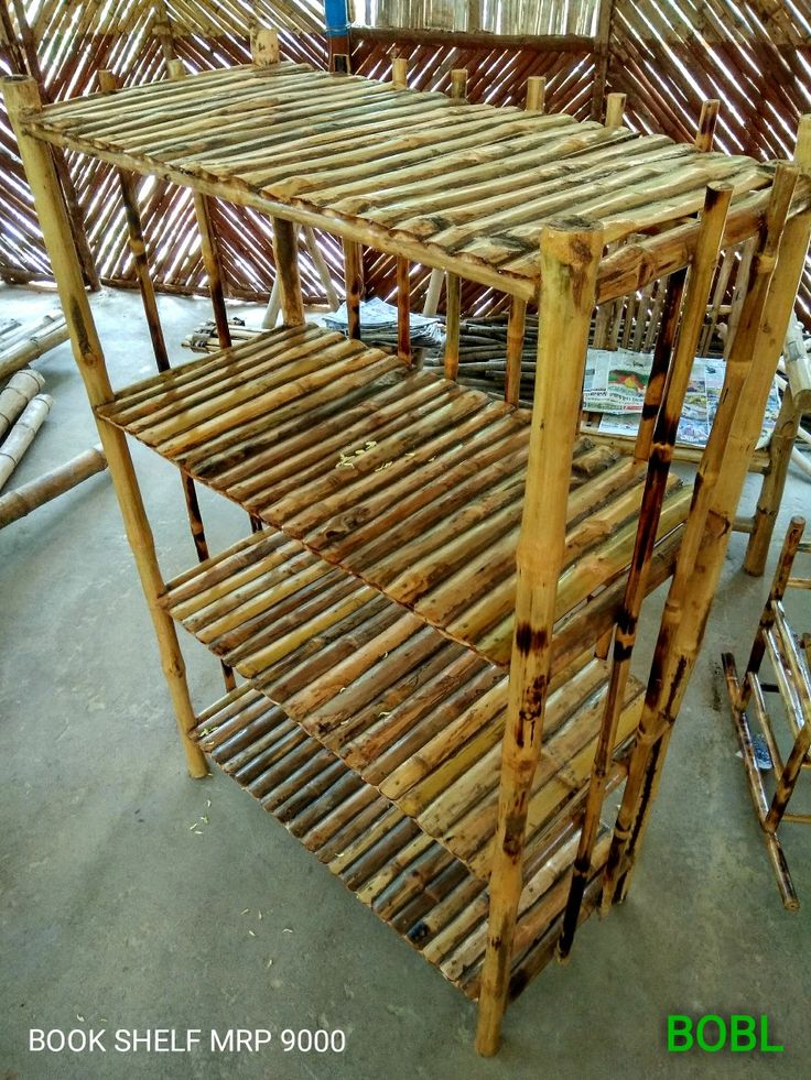 several wooden shelves stacked on top of each other in a room with bamboo roofing