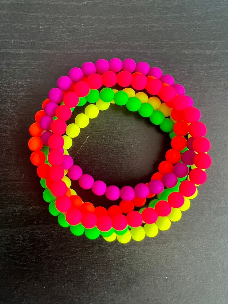 Set of 5 neon bracelets. Neon purple, neon pink, neon orange, neon yellow and neon green. These fun stretch bracelets can be worn alone or stacked. Made with fire polished glass beads with a matte finish. Handmade beaded Handmade jewelry Handcrafted Fashion handmade Cuff Women's bracelet Bracelet charms Beaded bracelet design Glass beaded bracelet Affordable bracelets Fashion jewelry Gifts Mama Mama gift Gender reveal Personalized  Custom  Boy mom Girl mom Colorful Alphabet Party favor bracelet Gift for her  Fall color Single strand Colorful Color choice bohemian Birthday Coordinated colors Tiny Quality Dainty Matte Frosted Shiny Hippie Yoga Trendy Evil eye For teens Layer Preppy Outer banks Charlotte Hampton New York Neutral Aesthetic Naranja, 80s Colors, Alphabet Party, Bohemian Birthday, Neon Accessories, Neon Bracelets, Festival Bracelets, Colorful Alphabet, Purple Neon