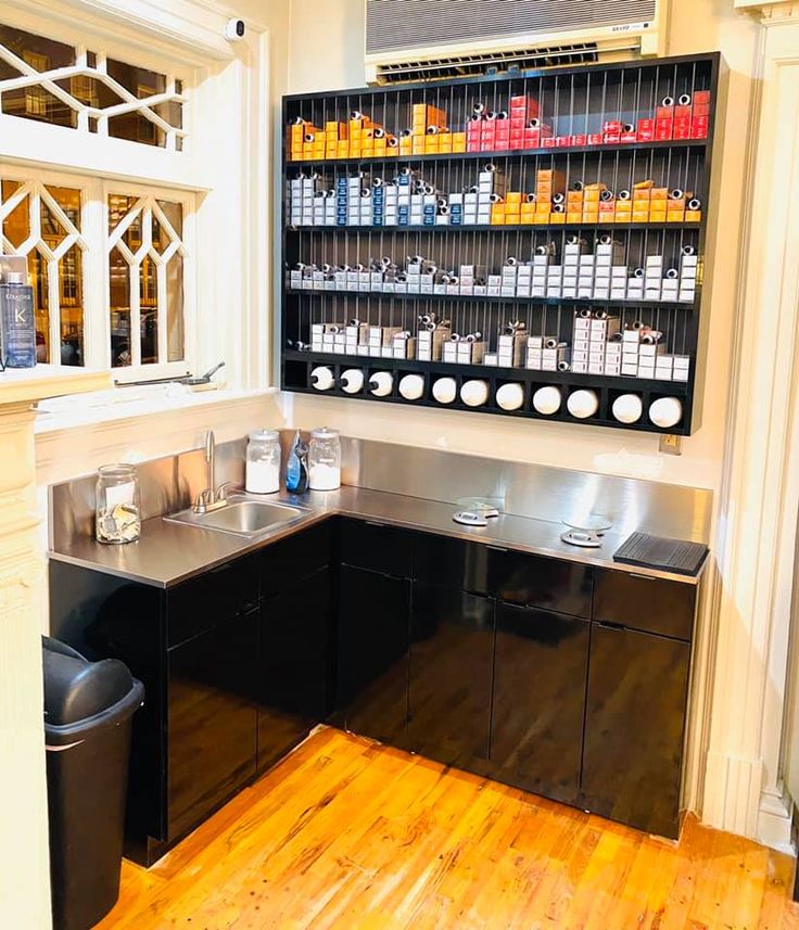 an empty counter in a store with lots of bottles and containers on the wall behind it