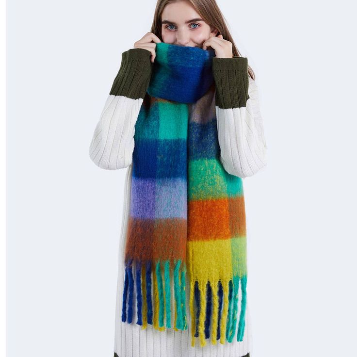 Introducing our Fringed Knitted Plaid Shawl oversize Scarf! Stay cozy, warm, and stylish with this fluffy must-have accessory. The vibrant colors will make a statement, while the oversized design will keep you snug. Wrap it around you for a chic and playful look. Perfect for any occasion! SIZE:(W)13.80"X(L)86.6" 100% POLYESTER Warm Acrylic Scarves For Fall, Multicolor Scarves For Cold Weather In Fall, Trendy Blue Winter Scarves, Fall Acrylic Scarves, Warm Multicolor Scarves For Fall, Cozy Acrylic Scarves For Winter, Warm Casual Scarves One Size, Trendy Scarves For Cold Weather, Chunky Knit Acrylic Scarf For Winter