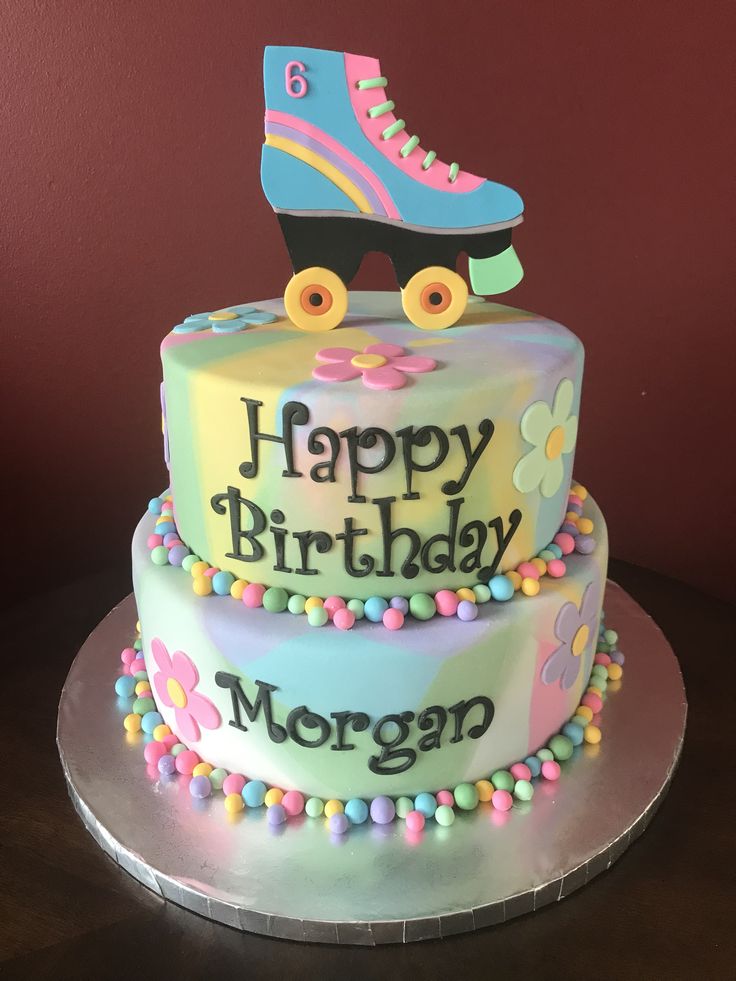 a birthday cake with roller skates on top