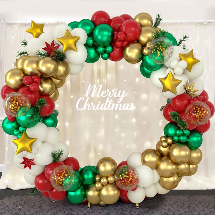 a christmas wreath made out of balloons and stars