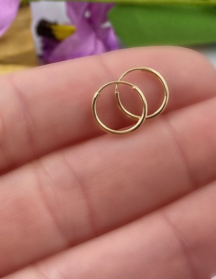 14K Solid Gold Hoop Earrings - 14K Endless Hoops, Hoop Earring, Small Hoops, Thin Hoop Earrings, Dainty Hoop, Dainty Gold Earrings. Dainty endless hoop earrings, simple and beautiful! These endless hoops are perfect for everyday wear. ✦Price is for a pair of earrings, if you only need please message me. ✦Endless hoops measure 10mm or 12mm and 14K yellow gold 🎁 Comes ready to gift in a gift box or bag. ♥BUY WITH CONFIDENCE♥ Please know I take customer service very seriously! There is nothing I w Small Gold Hoop Earrings Simple, Gold Tiny Hoop Earrings, Small Ring Earrings Gold, Simple Gold Round Earrings, Dainty Nose Ring, Minimalist Accessories Jewellery, Small Hoops Earrings, Simple Gold Hoop Earrings, Small Hoop Earrings Gold