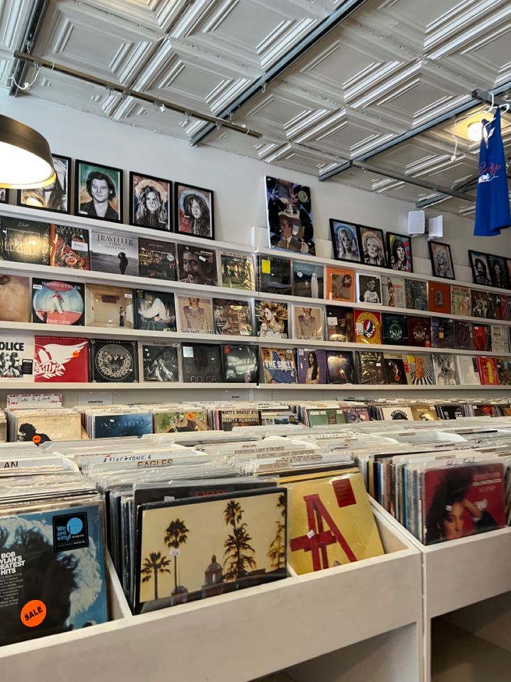 the inside of a record store with various records on shelves