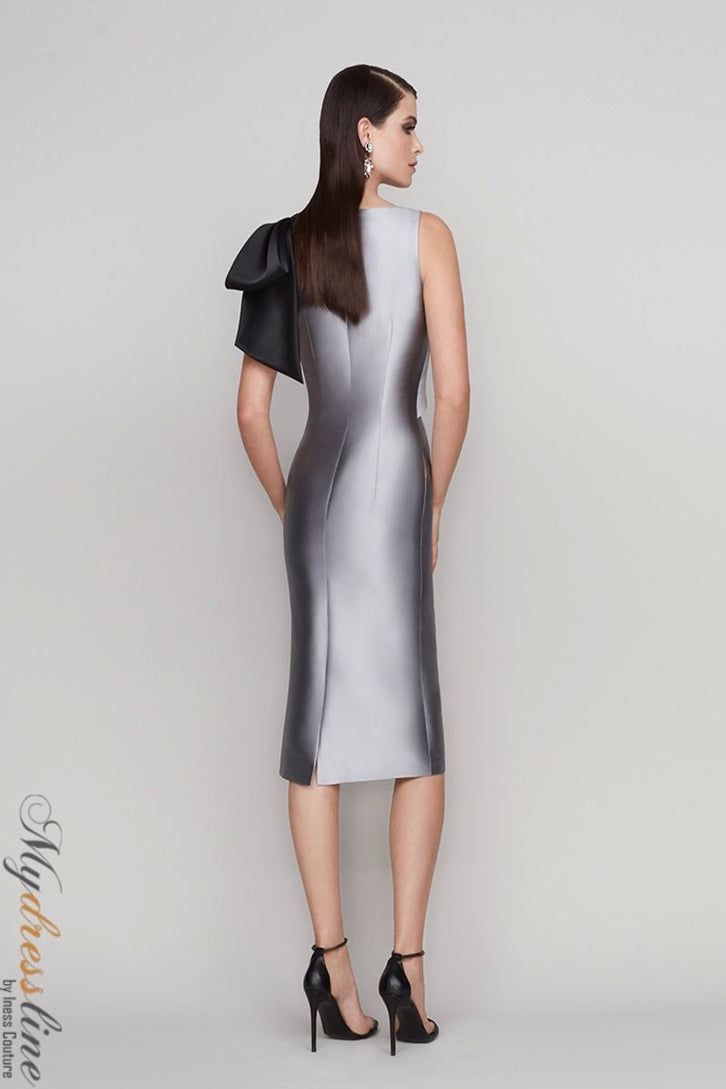 Looking for a sleek and sophisticated sleeveless dress? Check out the Frascara 4112. This stunning dress features a draped bodice with a bow at the shoulder, and a sheath skirt silhouette with a back vent. It's made from 51% silk and 49% wool, and it's satin-lined for a luxurious feel. Plus, it has a hidden back zipper for easy on and off. Sleeveless Tie Back Evening Dress For Cocktail, Fitted Dress With Bow Tie Back For Gala, Formal Fitted Dress With Bow Tie Back, Fitted Silk Evening Dress With Tie Back, Classic Silk Evening Dress For Party, Elegant Dresses With Bow And Fitted Bodice, Elegant Sleeveless Tie-back Evening Dress, Sleeveless Tie-back Cocktail Evening Dress, Elegant Bow Tie Back Dress For Wedding