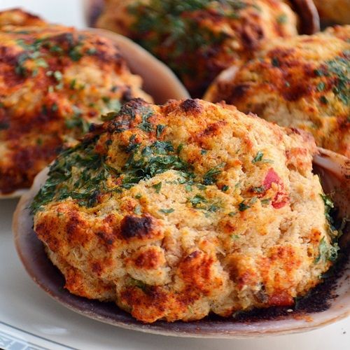 some crab cakes are on a plate and ready to be eaten