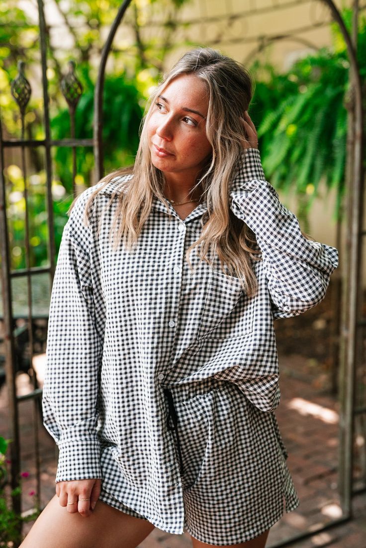 The Urban Moments Gingham Set - Top redefines modern chic with its relaxed, oversized silhouette and timeless gingham pattern. This top features a button-up front that adds a touch of classic sophistication, while the loose fit provides an effortlessly stylish and comfortable drape. Crafted from a soft, breathable fabric, it ensures all-day comfort and easy movement. Perfect for both casual outings and laid-back office wear, the Urban Moments Gingham Top is a versatile wardrobe staple that combi Chic Plaid Blouse For Daywear, Gingham Button-up Tops For Fall, Plaid Blouse For Day Out In Fall, Oversized Plaid Blouse For Spring, Plaid Blouse For Fall Day Out, Fall Gingham Button-up Tops, Relaxed Fit Plaid Blouse For Daywear, Chic Gingham Long Sleeve Tops, Plaid Long Sleeve Blouse For Day Out