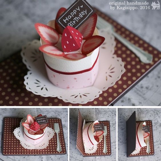 the cake is decorated with strawberries and has a happy birthday tag on it's top