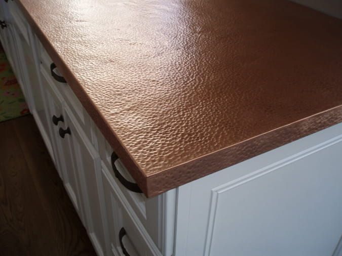 a kitchen counter top that is shiny brown