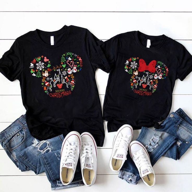 two t - shirts with mickey and minnie mouse heads on them, sitting next to each other