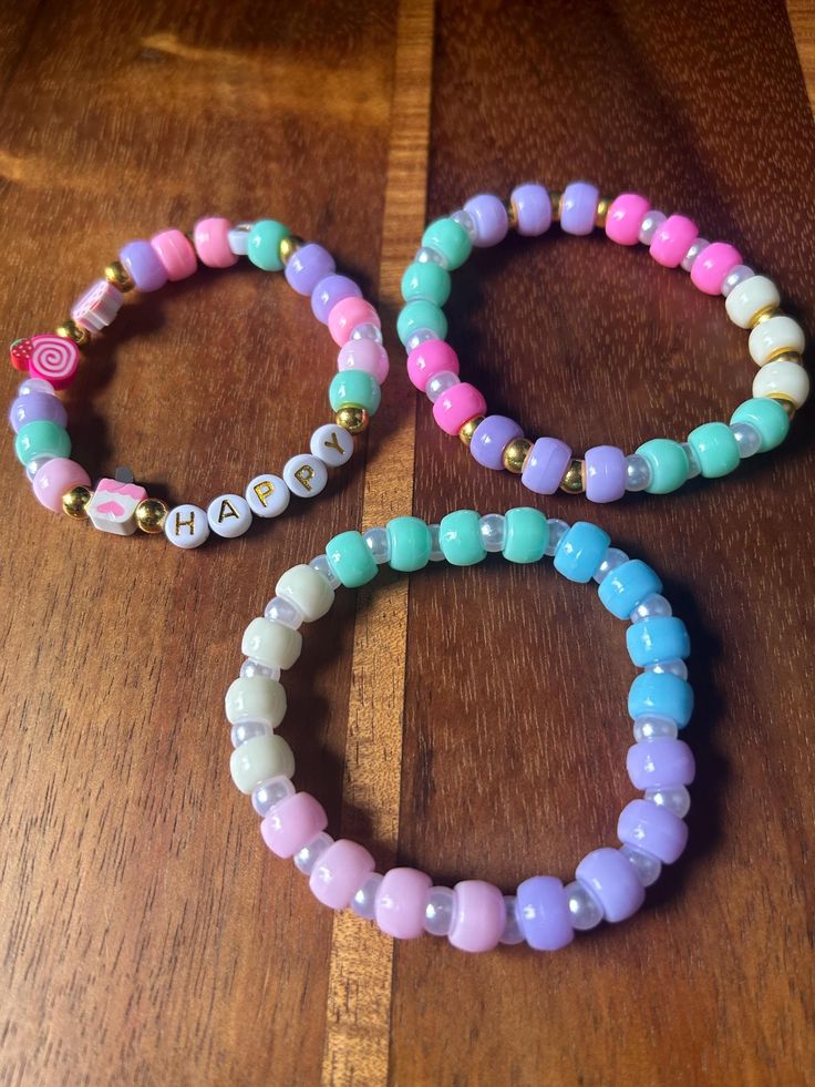 Pastel 8m pony beads, "Happy" lettering and clay charms.  Stretch bracelet 3 set Easter Clay Bead Bracelets, Bracelets With Pony Beads, Easter Bracelet Ideas, Pony Bead Bracelet Ideas, Bracelet Ideas Pony Beads, Happy Lettering, Make Clay Beads, Pony Bead Bracelets, Cute Bunny Pictures