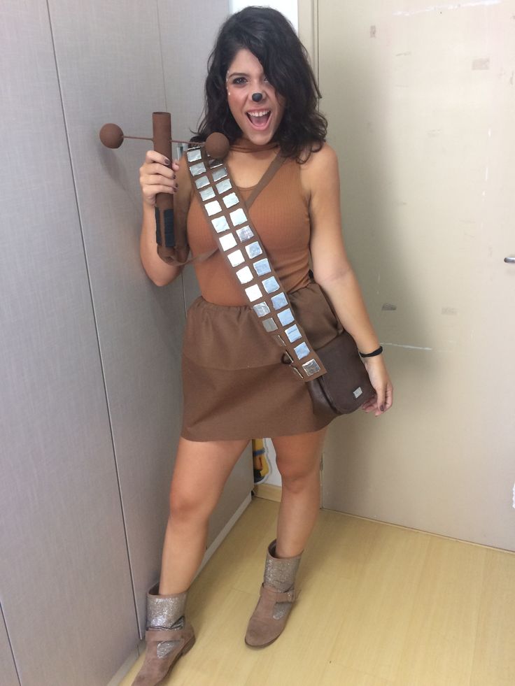 a woman in a star wars costume is posing for the camera