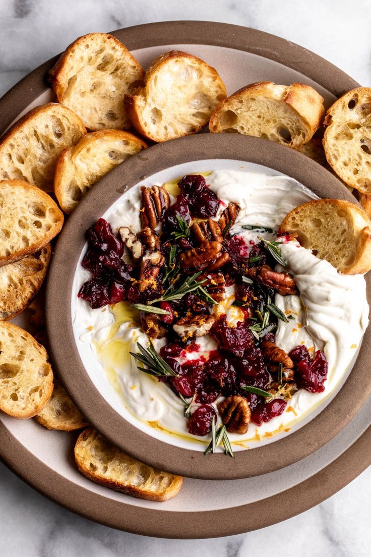 a white plate topped with bread and cranberry sauce