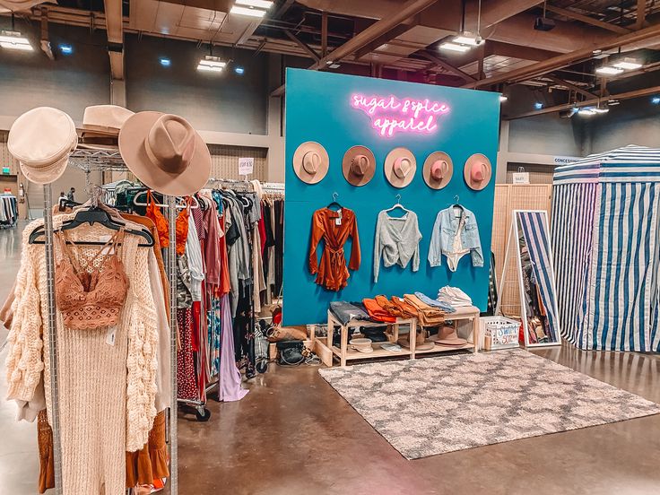 a room filled with clothes and hats on display