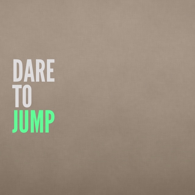 the words dare to jump written in green on a beige background